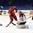 SPISSKA NOVA VES, SLOVAKIA - APRIL 21: Pavel Azhgirei #23 of Belarus with a scoring chance against Latvia's Niklavs Rauza #30 while Niks Krollis #26 looks on during relegation round action at the 2017 IIHF Ice Hockey U18 World Championship. (Photo by Andrea Cardin/HHOF-IIHF Images)

